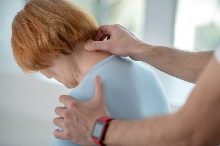 Cervicogenic Headache. Close up of a female neck .