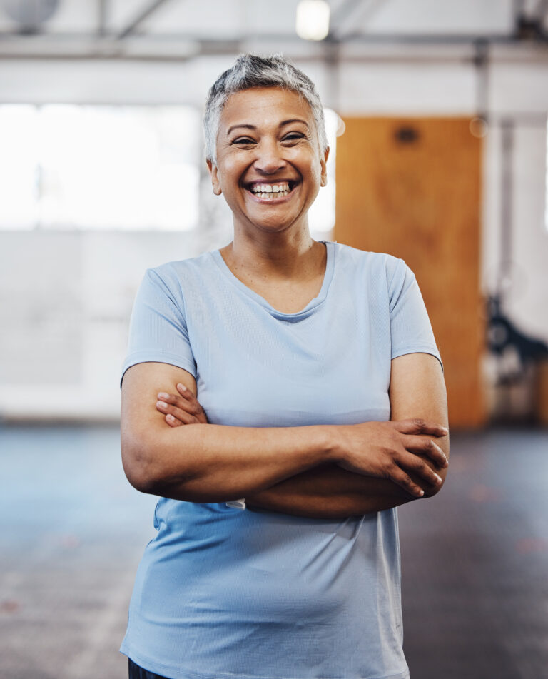senior-black-woman-gym-and happy about chiropractic care for lower back pain.